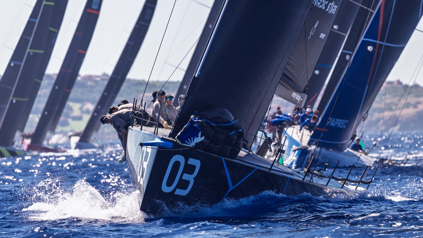Nordic Stars crossing a crowded TP52 start line ahead of the fleet